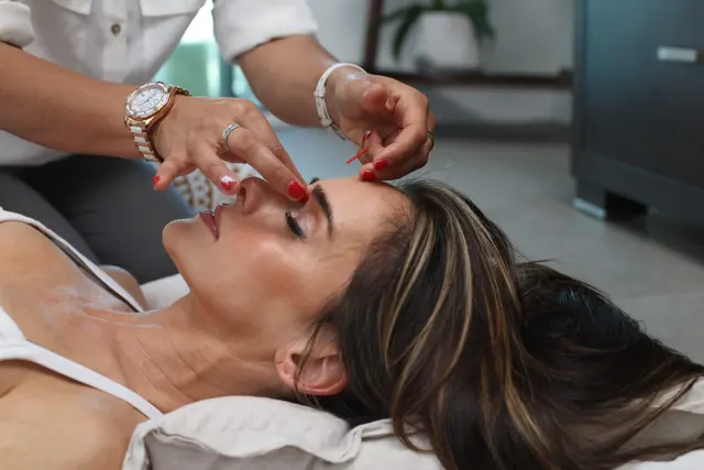 Patient relaxing during a gentle laser facial treatment