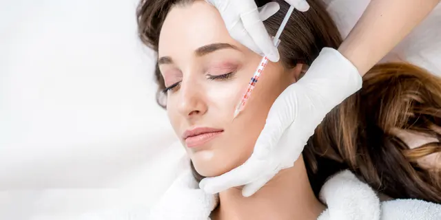 Dermal filler injection along the cheek at a Springville medical spa
